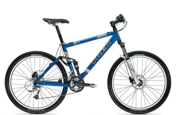 Trek Fuel 70: A blue Trek mountain bike with a dual suspension frame, knobby tires, and front disc brakes, positioned at a slight angle to showcase its design and features.