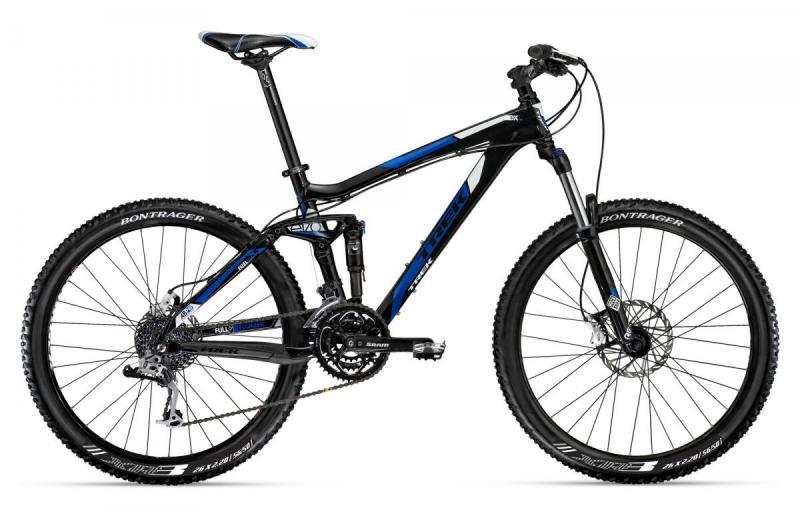Trek Fuel EX 5: A black and blue mountain bike with a full suspension design, featuring disc brakes and a modern frame layout. The bike is positioned upright against a white background, showcasing its tires, gears, and handlebar details.