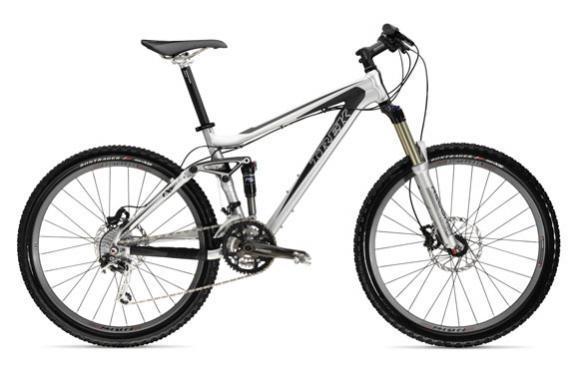 Trek Fuel EX 7: A modern mountain bike with a sleek silver and black frame, featuring front suspension, disc brakes, and knobby tires designed for rugged terrain.