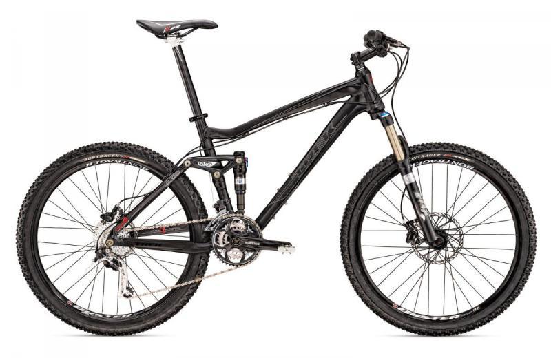 Trek Fuel EX 8: Image of a modern black mountain bike featuring a lightweight frame, front suspension fork, and wide tires designed for rugged terrain. The bike includes multiple gears and a sleek design, suitable for outdoor cycling adventures.