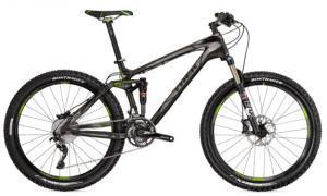 Trek Fuel EX 9.8: A black and green mountain bike featuring a lightweight frame, front suspension, and disc brakes, positioned on a white background.