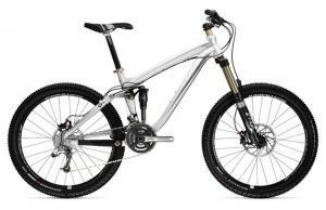 Trek Remedy 9: A silver and black mountain bike with thick tires, front suspension, and a sleek frame design.