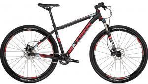 A black and red mountain bike with a lightweight frame, disc brakes, and thick tires suitable for off-road cycling.