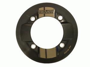Truvativ RockGuard: Black circular motorcycle wheel rim with a central hole and multiple mounting holes, featuring the "TRUVAITI" logo in gold.