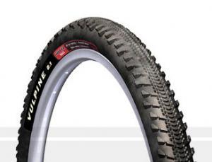 WTB Vulpine 29er: A profile image of a bicycle tire with a tread designed for off-road use. The tire is labeled "Vulpine" and features a silver rim.