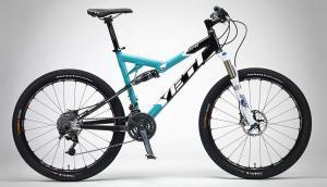 Yeti AS-R (Alloy): A blue and black mountain bike with thick tires, front suspension, and disc brakes, displayed against a neutral background.