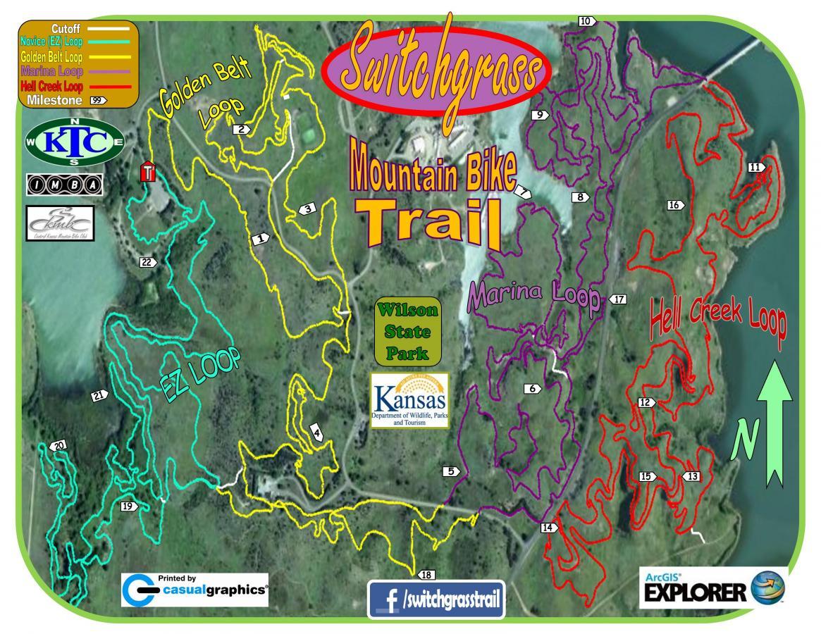 Map of Switchgrass Mountain Bike Trail at Wilson State Park, highlighting various loops including the Golden Belt Loop, EZ Loop, Marina Loop, and Hell Creek Loop, with marked milestones and directions. The map features color-coded trails and a north indicator. Switchgrass mountain bike trail.