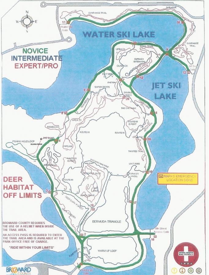 Map of a recreational area featuring two main lakes: Water Ski Lake and Jet Ski Lake. The map indicates various trails and skill levels for water skiing and jet skiing, along with designated areas to avoid, such as deer habitats. Emergency location signs are also marked on the map. Captain Jack's mountain bike trail.