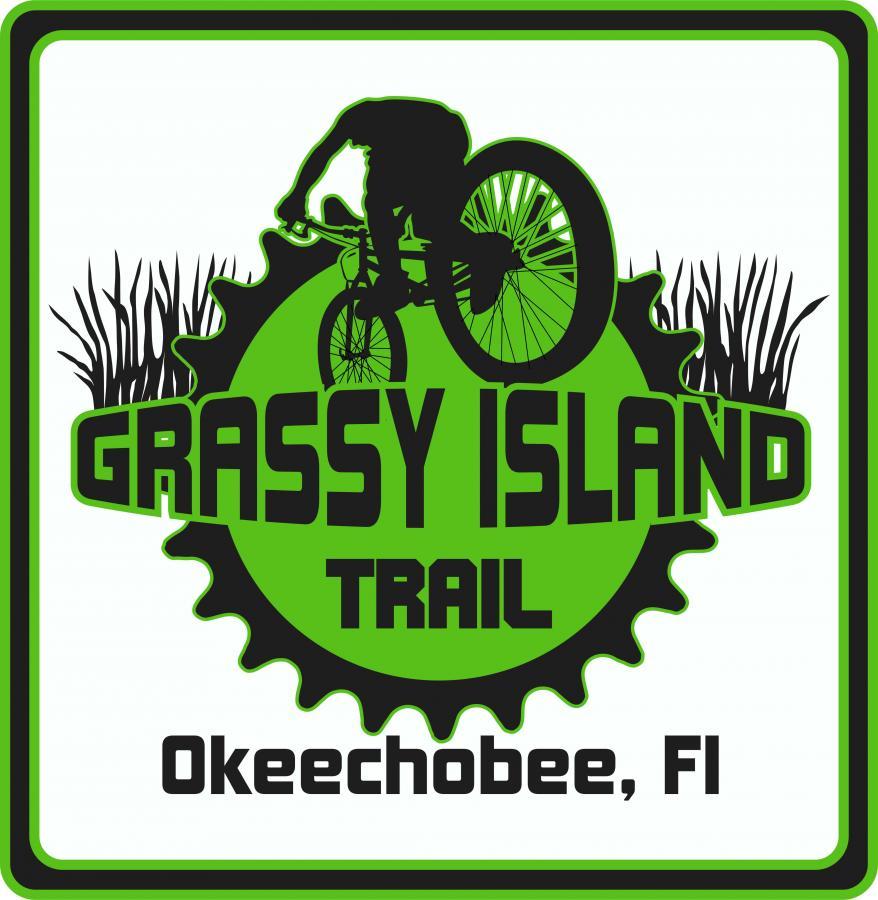 Logo design for Grassy Island Trail in Okeechobee, Florida, featuring a silhouette of a cyclist performing a trick on a bike. The text "GRASSY ISLAND" is prominently displayed in bold letters, with "TRAIL" beneath it. The color scheme includes various shades of green, complemented by a gear graphic and grass elements in the background. Grassy Island Trail mountain bike trail.