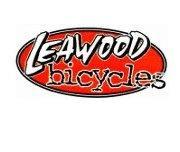 Logo for Leawood Bicycles, featuring an oval shape with a red background and stylized white text.