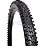 WTB Bronson 2.3: A close-up image of a black mountain bike tire featuring a tread pattern designed for improved traction on uneven surfaces. The tire shows prominent knobs for enhanced grip.