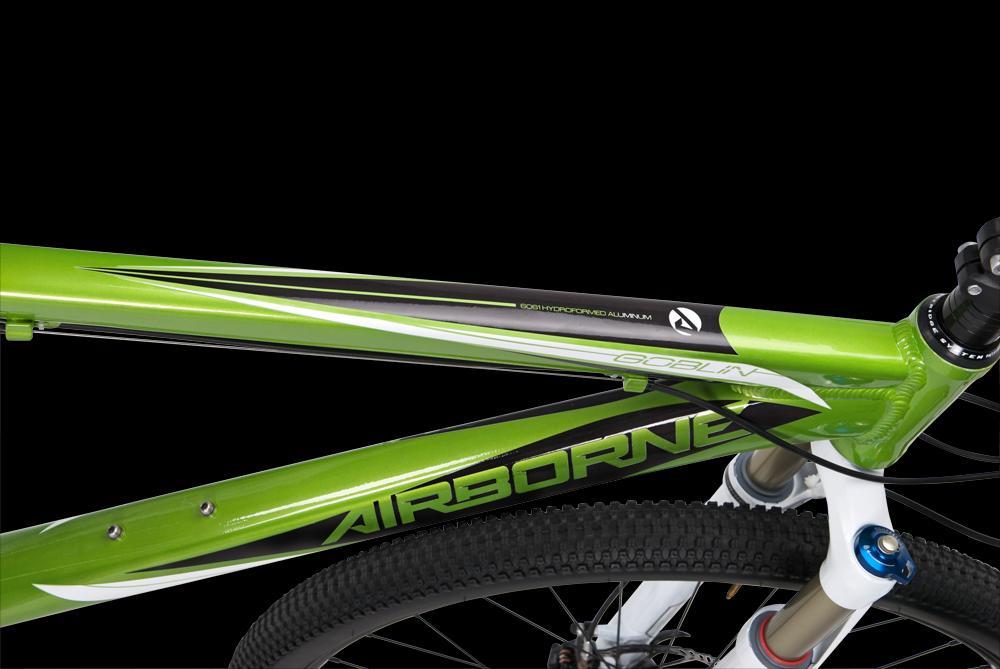 Airborne Goblin: Image of a close-up of a green mountain bike frame, highlighting the "Airborne" brand and "Goblin" model. The frame features a sleek design with black and white accents, set against a black background.