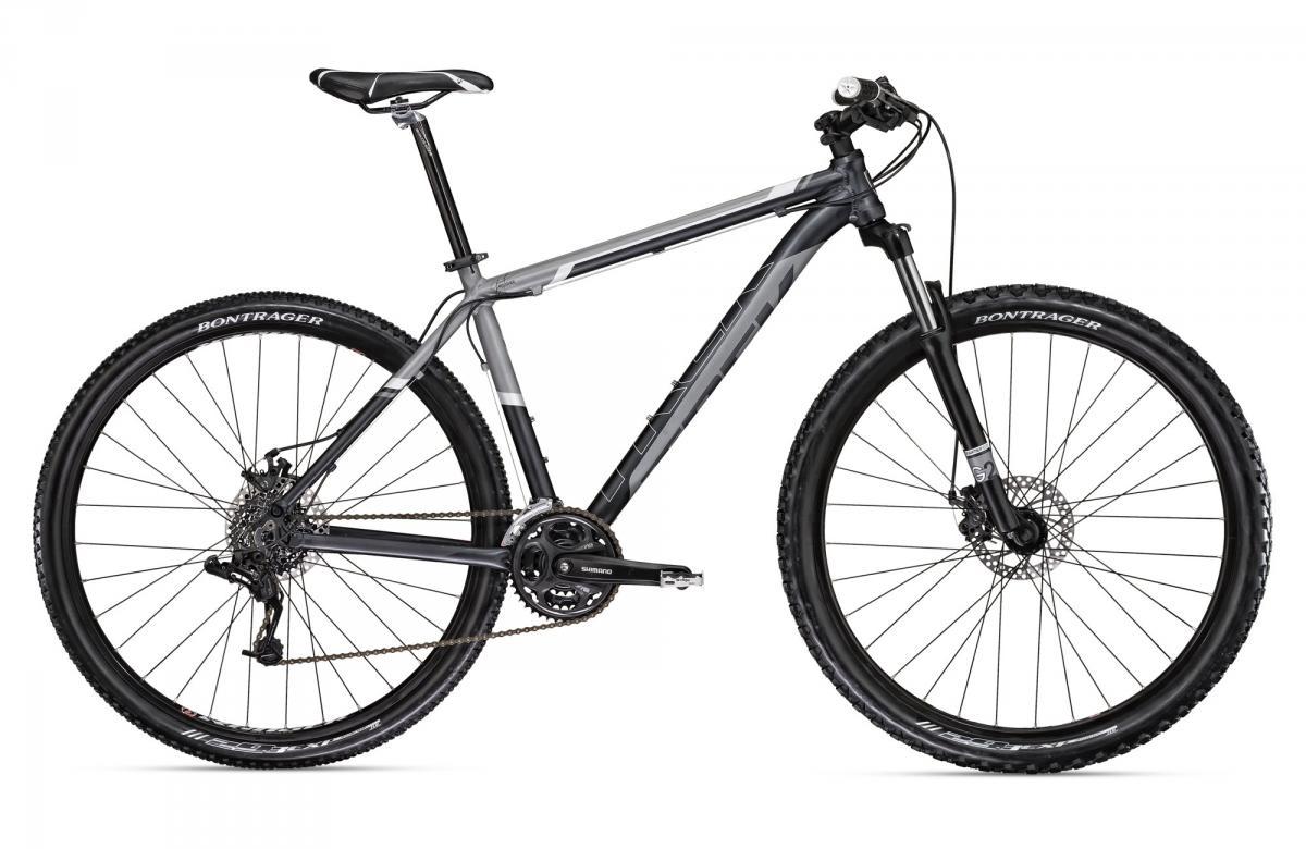 Trek Marlin: Image of a modern mountain bike featuring a sleek gray and black frame, front suspension forks, and disc brakes. The bike has a Shimano drivetrain and Bontrager tires, designed for off-road cycling.