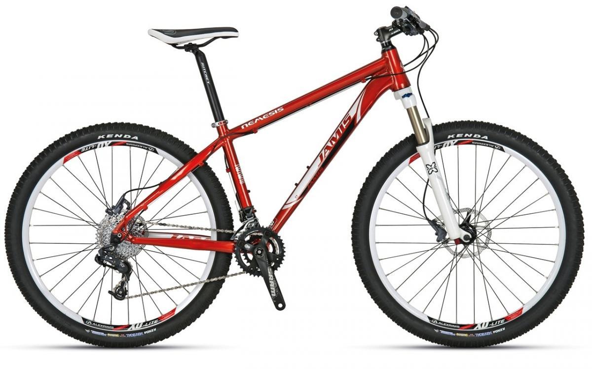 Jamis Nemesis: A red mountain bike with a lightweight aluminum frame, featuring a front suspension fork, disc brakes, and rugged tires. The bike is positioned against a neutral background, showcasing its design and components.