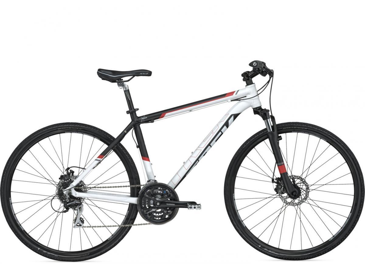 Trek 8.3 DS: A modern mountain bike with a sleek design, featuring a white and black frame with red accents. It has a dual suspension system, disc brakes, and lightweight wheels, making it suitable for both on-road and off-road cycling. The bike is shown from the side, highlighting its stylish geometry and various components.
