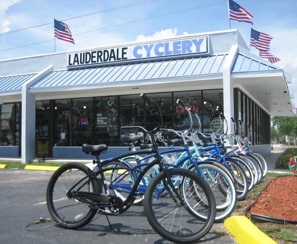 Alt text: Exterior view of Lauderdale Cyclery bike shop featuring multiple bicycles on display outside, with the store