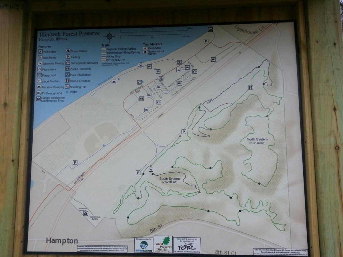 Map of Illiniwek Forest Preserve in Hampton, Illinois, detailing features such as trails for hiking and cycling, picnic areas, restrooms, and campgrounds. The map includes labeled sections for the North and South trail systems, along with points of interest and amenities available in the preserve. Illiniwek Forest Preserve mountain bike trail.