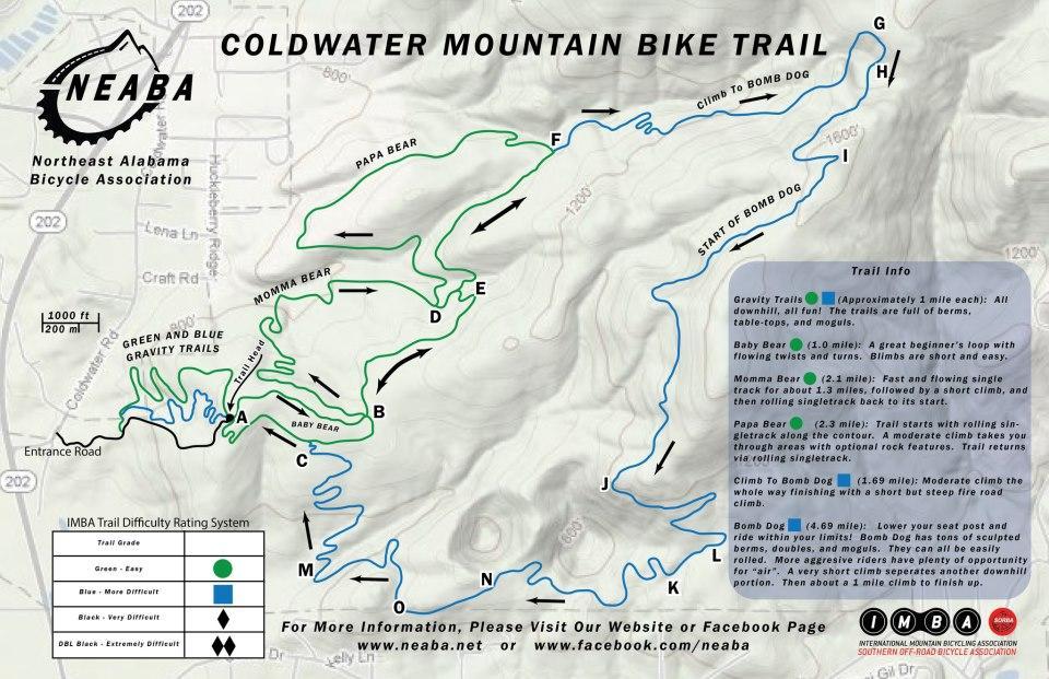 Map of Coldwater Mountain Bike Trail in Northeast Alabama, showing various bike routes labeled with names and difficulty levels. The map includes key features like trail entrances, elevation markers, and a difficulty rating system (green for easy, blue for difficult, and black for very difficult). Trail segments include Baby Bear, Momma Bear, Papa Bear, Climb to Bomb Dog, and Bomb Dog, along with descriptions of each trail's characteristics and distance.  Coldwater Mountain mountain bike trail.