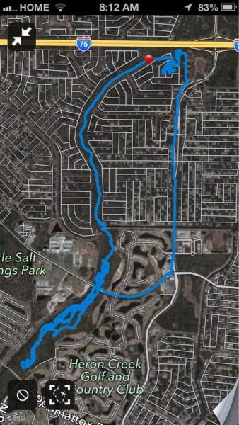 Map displaying a GPS tracking route marked in blue, outlining a path through residential neighborhoods and parks, with a red pin indicating the starting point. North Port Mountain Bike Trails mountain bike trail.