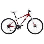 Kona Nunu: Mountain bike with a red and white frame, featuring dual suspension, disc brakes, and thick tires suitable for off-road trails.
