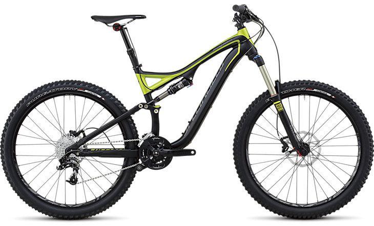Specialized Stumpjumper FSR: Alt tag: A modern mountain bike featuring a black and lime green frame, front suspension forks, wide tires, and a detailed gear system, positioned against a white background.