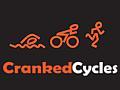 Logo of Cranked Cycles featuring stylized icons of swimming, cycling, and running, with the text "Cranked Cycles" in orange and white against a black background.