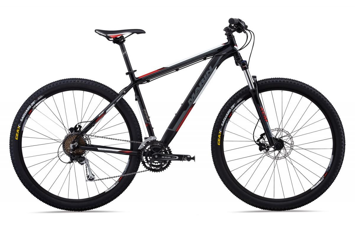Marin Bolinas Ridge 29er: A black and red mountain bike with a sleek frame design, featuring wide tires, disc brakes, and a gear system. The bike is shown from the side, highlighting its sturdy construction and performance-oriented features.