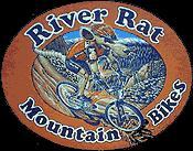 Illustration of a mountain biker riding a bike on rocky terrain, surrounded by a mountainous landscape. The logo features the text "River Rat" at the top and "Mountain Bikes" at the bottom, set against an orange background.