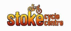 Logo of Stoke Cycle Centre, featuring the word "stoke" in bold letters with a bike icon above it, and the words "cycle centre" in a smaller font below. The colors transition from yellow to orange.