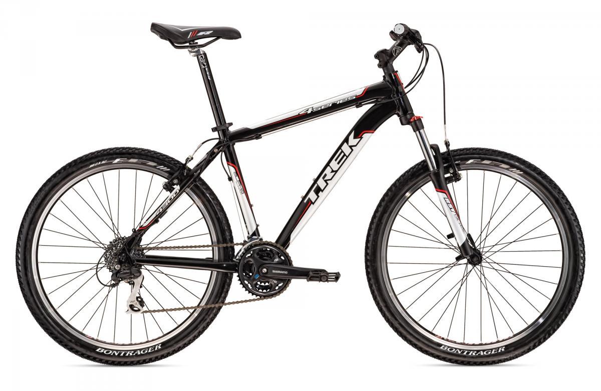 Trek 4300: A black and silver Trek mountain bike, featuring wide tires and a lightweight aluminum frame. The bike is equipped with a Shimano gear system, disc brakes, and a comfortable ergonomic seat, positioned against a plain background.