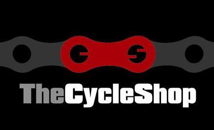 Logo for The Cycle Shop featuring a bicycle chain link design in red and gray against a black background. The text "The Cycle Shop" is displayed prominently in bold, with "Cycle" in gray and "Shop" in white.