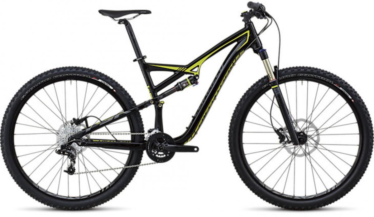 Specialized Camber: A black and yellow mountain bike with a sleek design. The bike features large wheels, a dual suspension system, and disc brakes, making it suitable for off-road trails. The frame is lightweight and modern, showcasing a combination of functionality and style.