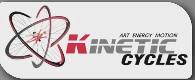 Logo for Kinetic Cycles featuring a stylized bicycle wheel intertwined with an atomic symbol, accompanied by the text "Kinetic Cycles" prominently displayed. The tagline "Art Energy Motion" is featured above the logo.