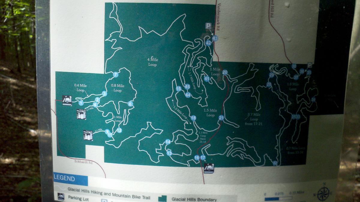 Map of Glacial Hills Hiking and Mountain Bike Trail, showing various loop options and distances ranging from 0.4 miles to 4 miles, along with key landmarks, parking areas, and trail boundaries. Glacial Hills mountain bike trail.
