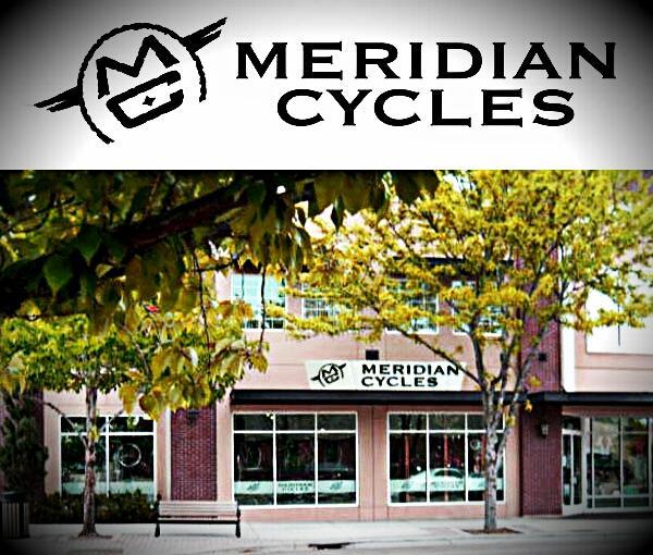 Image of the storefront of Meridian Cycles, featuring large windows and a prominent sign displaying the shop
