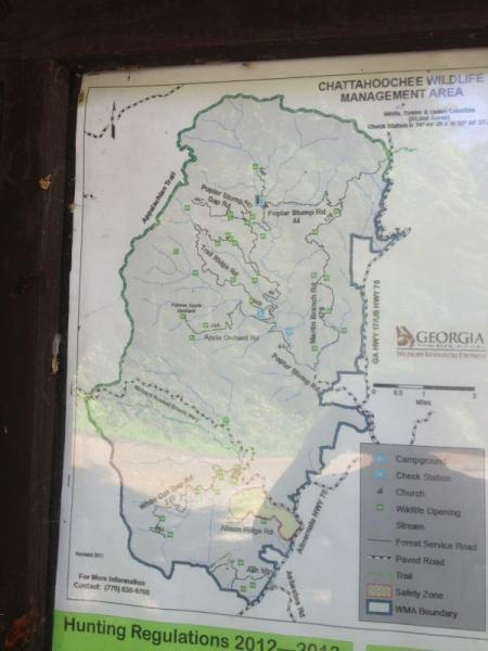 Map of the Chattahoochee Wildlife Management Area in Georgia, showing trails, roads, and designated areas for camping and wildlife activities. Includes information on hunting regulations for the years 2012 to 2014. Jasus Creek mountain bike trail.