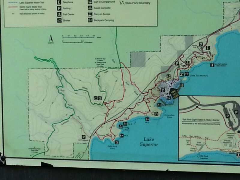 Map of Lake Superior, highlighting hiking trails, campsites, and points of interest in a state park setting. Includes trail routes, campground locations, parking areas, and key landmarks. The map shows the shoreline of Lake Superior and surrounding terrain features. Split Rock Light House State Park mountain bike trail.