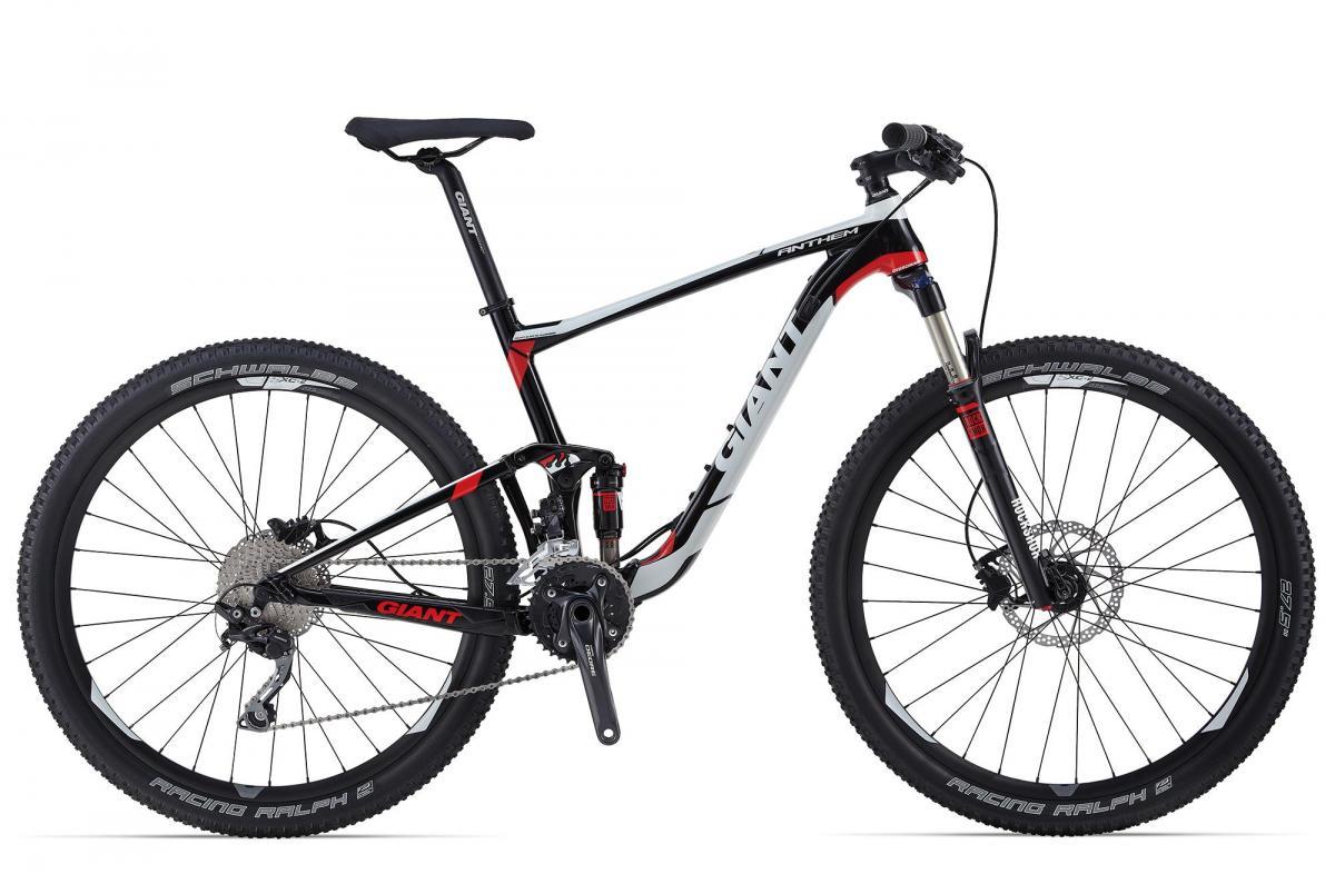Giant Anthem 1: Alt text: A sleek, black and red mountain bike with the brand name "Giant" visible. It features front and rear suspension, wide tires with "Schwalbe Racing Ralph" written on them, and a gear system on the side. The bike is positioned against a plain white background.