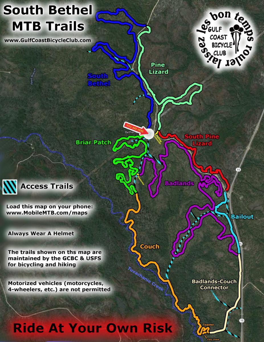 Map of the South Bethel Mountain Bike Trails, featuring various colored trails designated for mountain biking and hiking. The map highlights access points, trail names, and safety guidelines, including a reminder to always wear a helmet. A specific location marked "You Are Here" indicates the visitor's current position. The Gulf Coast Bicycle Club logo is also present. Bethel Bike Trails mountain bike trail.