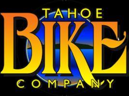 Logo for Tahoe Bike Company, featuring bold, stylized text with a gradient color scheme of yellow to orange, set against a circular background that suggests a mountain or lake theme.
