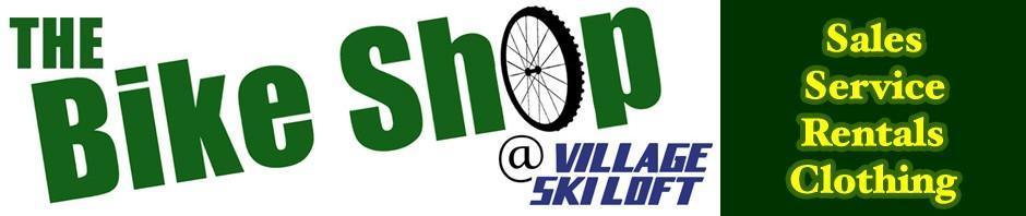 Alt text: Logo for "The Bike Shop at Village Ski Loft," featuring a bike wheel graphic. Text includes "Sales, Service, Rentals, Clothing" on a green background.