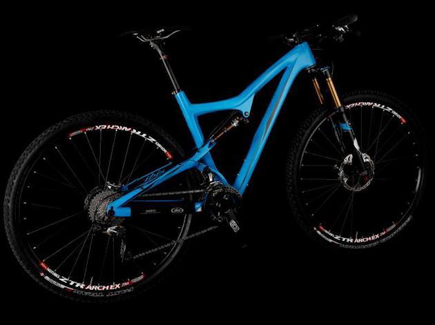 Ibis Ripley: A blue mountain bike with a modern frame design, featuring thick tires and high-quality components. The bike is shown against a black background, highlighting its sleek profile and colorful finish.