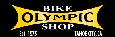 Black background featuring the text "BIKE OLYMPIC SHOP" in bold yellow and white font. Below, it states "Est. 1973" and "TAHOE CITY, CA." The design emphasizes a vintage style.