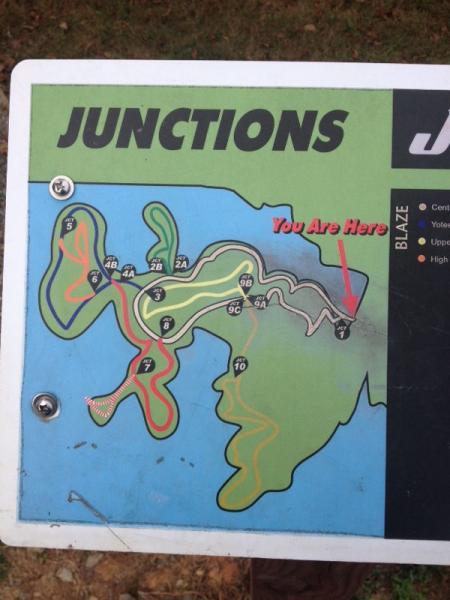 Map of a trail system labeled "Junctions," featuring various trail routes in different colors. The 'You Are Here' location is marked on the map with an arrow. The map includes trail numbers and designation information for navigation. Jack Rabbit Trails mountain bike trail.