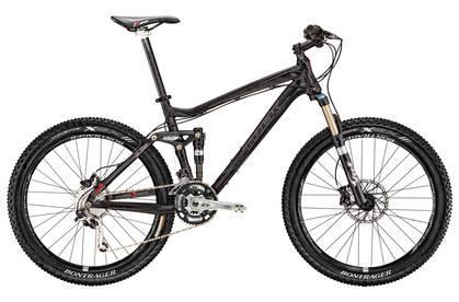 Trek Fuel EX 8: A black mountain bike with full suspension, featuring a sleek frame design, wide tires, and disc brakes. The bike has a modern setup suitable for off-road riding.
