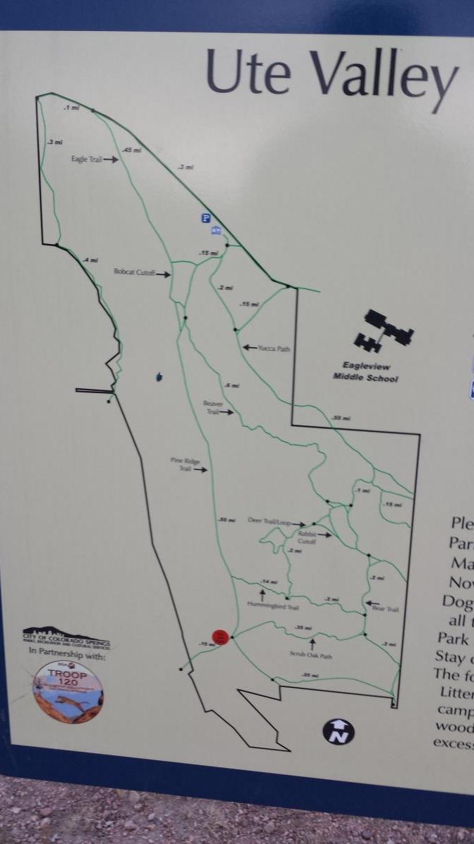 Map of Ute Valley Park showing various hiking trails, distances, and points of interest, including Eagleview Middle School. The map highlights trail names such as Eagle Trail, Bobcat Cutoff, and Pine Ridge Trail, with a clearly marked north orientation.  Ute Valley Park mountain bike trail.
