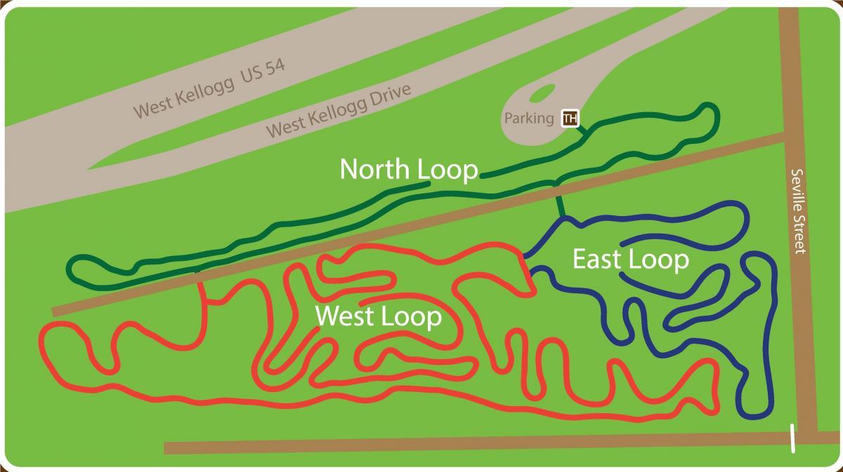 Map showing the layout of a walking or biking trail area, featuring three loops: North Loop (green), East Loop (blue), and West Loop (red). The map also includes nearby roads: West Kellogg Drive and Seville Street, along with a designated parking area. Air Capital Memorial Park mountain bike trail.