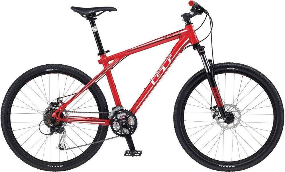 GT Avalanche: Red mountain bike featuring a lightweight frame, front suspension, and disc brakes, set against a white background.