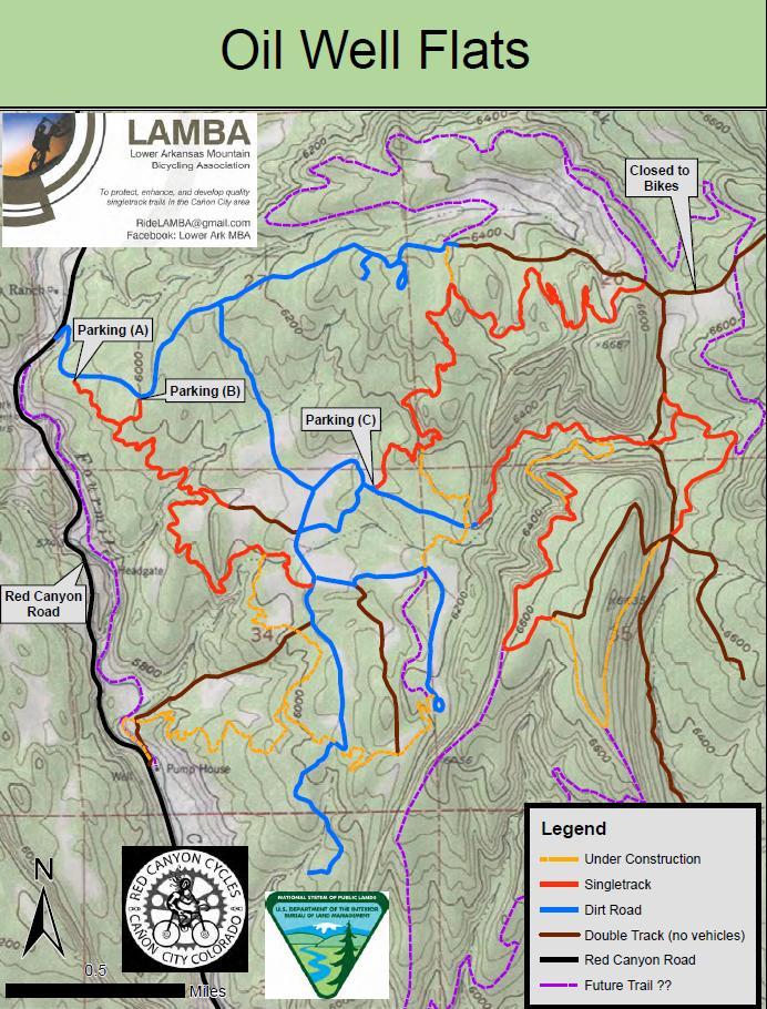 Map of Oil Well Flats illustrating various trails and paths for biking, with designated parking areas labeled (A, B, C). The map highlights different types of trails, including singletrack, dirt roads, and areas closed to bikes, along with significant landmarks like Red Canyon Road. The legend provides clarity on trail types and construction zones, along with an overview of elevation contours across the terrain. Oil Well Flats mountain bike trail.