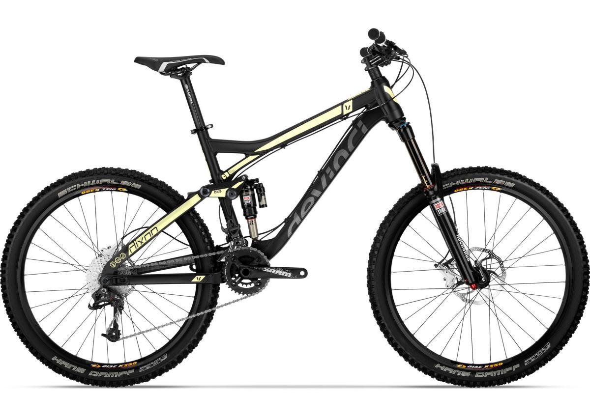 Devinci Dixon RS: Mountain bike featuring a black and lime green frame, equipped with front and rear suspension, wide tires, and a multi-speed gear system, designed for off-road trails and rugged terrain.